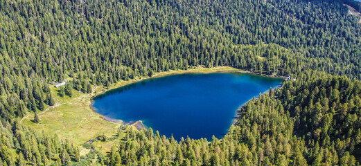 Malghette Lake, located in Sun Valley at 1900 m a.s.l. in the heart of Adamello Brenta Nature Park,...