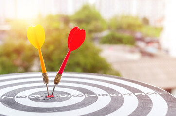 Bullseye is a target of business concept. business marketing as concept.Dartboard is the target and...