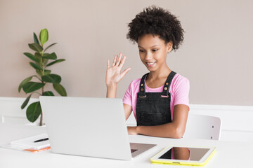 Cute little girl having meeting online. Kid using laptop at home. Education, studying, technology, communication, future, distance learning, homework, schoolgirl children lifestyle concept