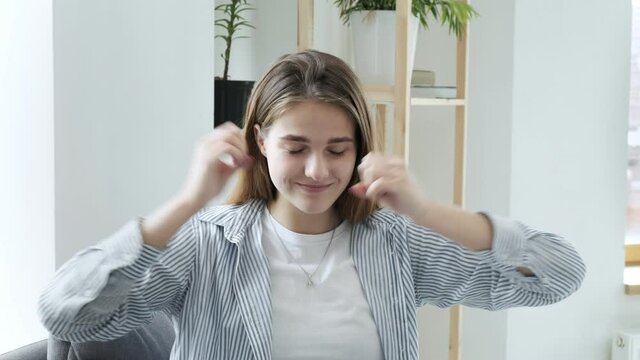 Mindblown reaction of millennial girl expressing astonishment, thrilling excitement. young caucasian woman in shocking situation, gesture of mind blown. She never expected this and she is surprised