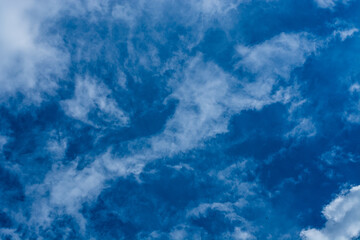 Beautiful rich blue sky with clouds. The concept of change, dream, goal setting or weather change.