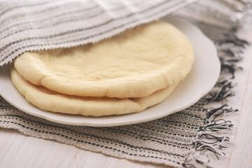 Uncooked flatbread on plate