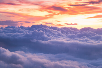 View at sunrise with puffy foggy. White puffy like cloud stretching to foggy horizon in the bright...