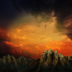 Dramatic sunset over mountains and rocks in fantasy land