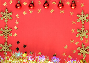 Flat lay holiday concept New Year, Christmas top view of Christmas balls, golden snowflakes, tinsel, lights . space for text, copy space
