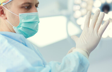 Man surgeon at work in operating room