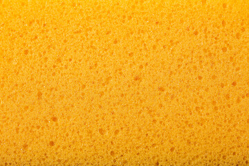 Fototapeta premium Yellow sponge background, close-up sponge.