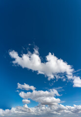Fantastic clouds against blue sky, panorama