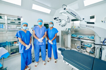 Ophthalmic surgical team in scrubs ready for performing laser vision correction