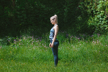 Blonde girl doing mountain pose. Tadasana. Yoga concept