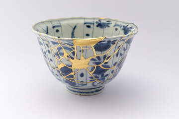 Kintsugi blue and white tea ceremony chawan tea bowl. Gold cracks restoration on old Japanese...