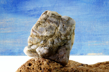 a piece of stone on blue background