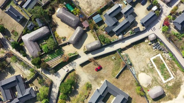 Aerial video of Andong Hahoe Folk Village in Autumn South Korea, A village surrounded by a river.