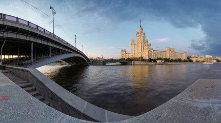 Fototapeta premium Sunset view of Kotelnicheskaya Embankment Building and Moscow river in Moscow, Russia.