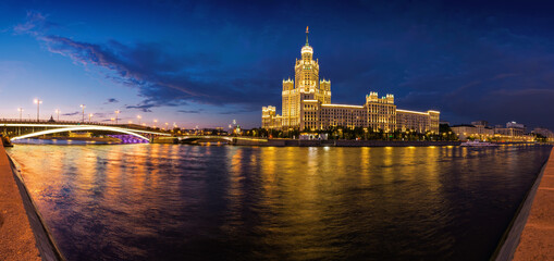 Fototapeta na wymiar Sunset view of Kotelnicheskaya Embankment Building and Moscow river in Moscow, Russia.