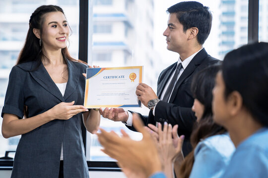 Business executives congratulate employees on their excellent work, Certificate of Excellence or a Certificate for Success in Work, Business people teamwork.