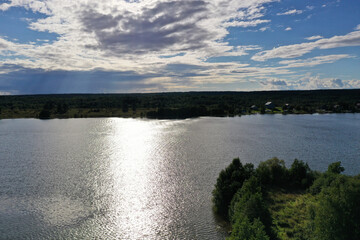 a panoramic view of the green islands on the lake with ships with ancient architectural buildings filmed from a drone