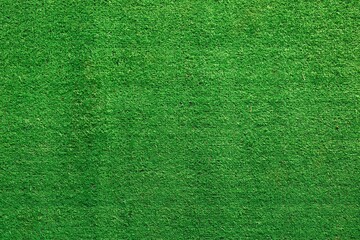 Green artificial grass. Fresh green grass background.