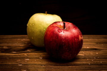 Ripe, juicy apples on wooden background