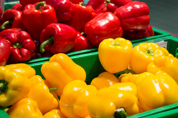 fresh ripe red and yellow sweet peppers from market