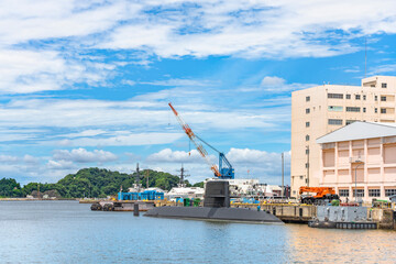 yokosuka, japan - july 19 2020: Wide angle view of the japanese submarine Takashio berthed in front of the japan maritime self-defense force Second Diving Group Command in the Yokosuka naval port.