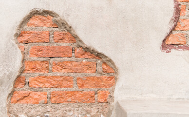red brick wall with white wall