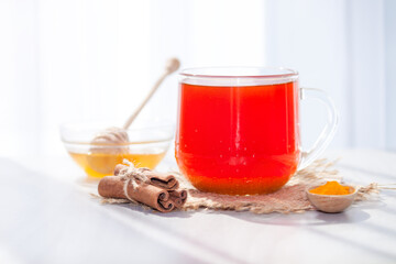 Turmeric tea with honey, cinnamon in the morning. Detox, healthy drink concept.