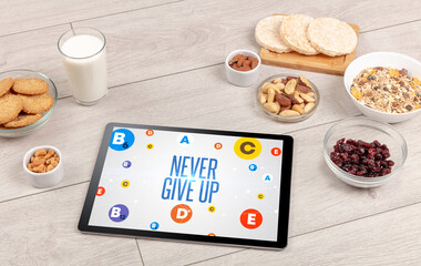 Healthy Tablet Pc compostion with NEVER GIVE UP inscription, weight loss concept