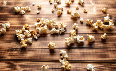 Popcorn flakes on a wooden background