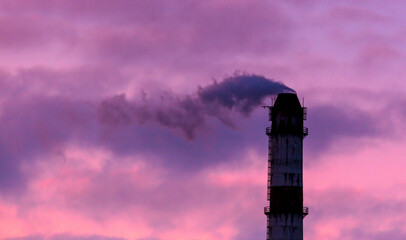 Smoke from the chimney at the factory against the backdrop