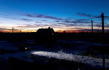 Fototapeta premium Dawn of the sun against a blue sky