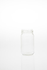 Isolated glass bottle on white background without cap.
