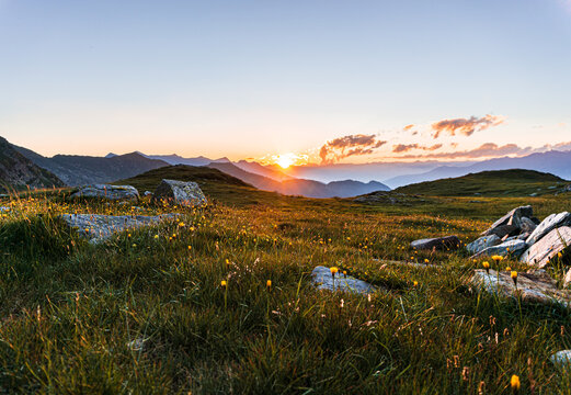 The sunset over the mountains of Lombardy while giving fantastic colors near the San Marco Pass, Italy - June 2020.
