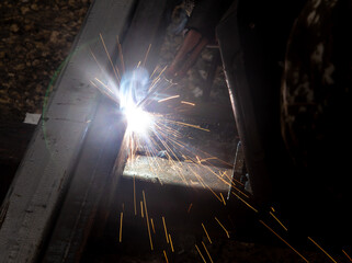 sparks from metal welding at a construction site