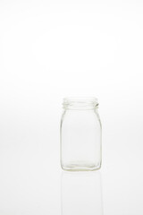 Isolated glass bottle on white background without cap.
