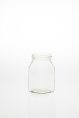 Isolated glass bottle on white background without cap.