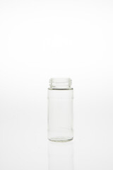 Isolated glass bottle on white background without cap.