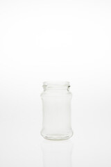 Isolated glass bottle on white background without cap.