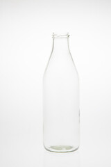 Isolated glass bottle on white background without cap.