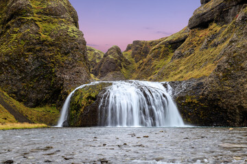 Colorful sunset at a waterfall in Iceland
