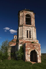 Fototapeta na wymiar Vintage, destroyed, overgrown with grass to the Christian Orthodox Church