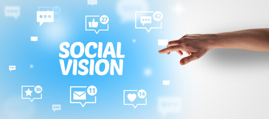 Close-Up of cropped hand pointing at SOCIAL VISION inscription, social networking concept