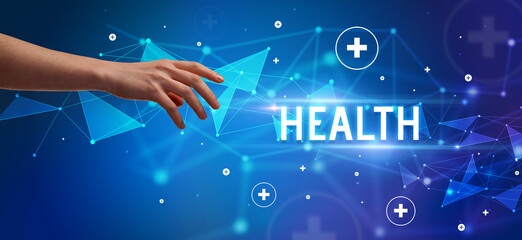 Close-Up of cropped hand pointing at HEALTH inscription, medical concept