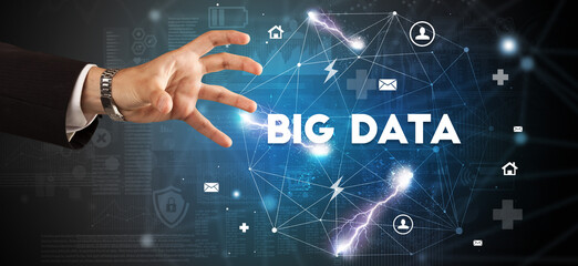 Hand pointing at BIG DATA inscription, modern technology concept