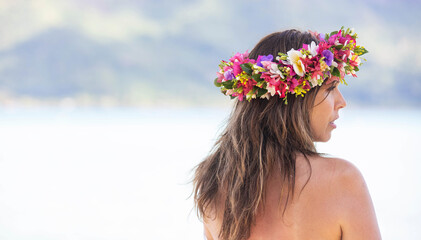 Beautiful woman wears colorful Tahiti flower crown
