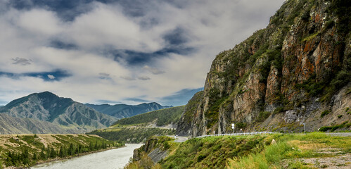 motor road in the mountains along the mountain river