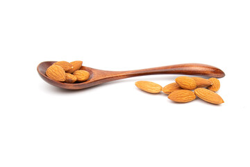 Nuts almonds in a wooden spoon on a white background