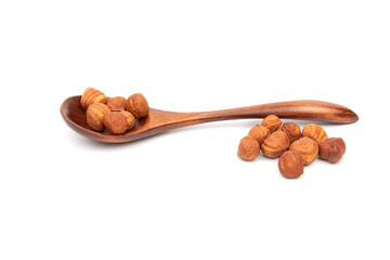 Nuts hazelnut in a wooden spoon on a white background