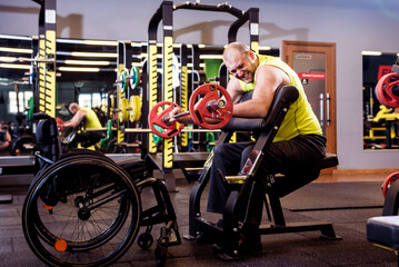 Fototapeta na wymiar Disabled man training in the gym of rehabilitation center