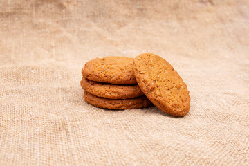 Oatmeal cookies on old burlap